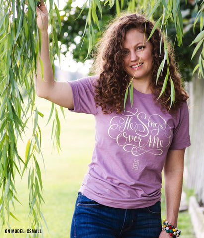 He Sings Over Me Tee – Heather Orchid